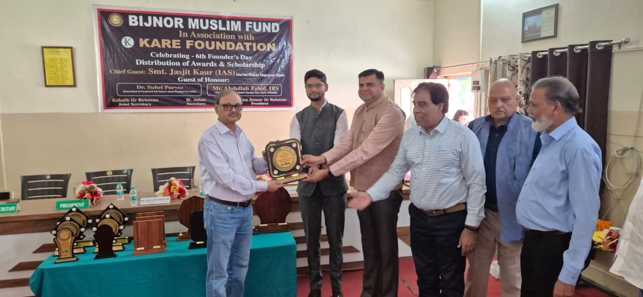 Award ceremony with dignitaries presenting scholarship trophies to students - 2025