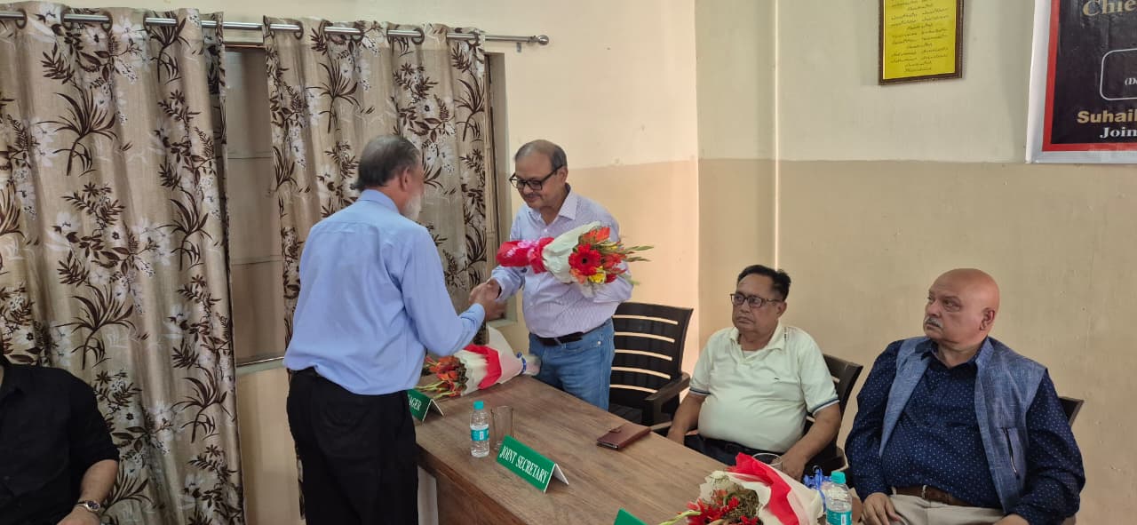 Guest being honored with flowers at scholarship ceremony - 2025